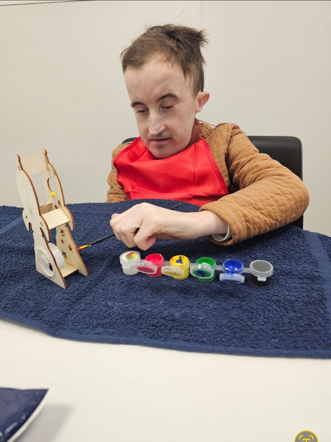 Ben creating artwork during an Illuminate Care activity